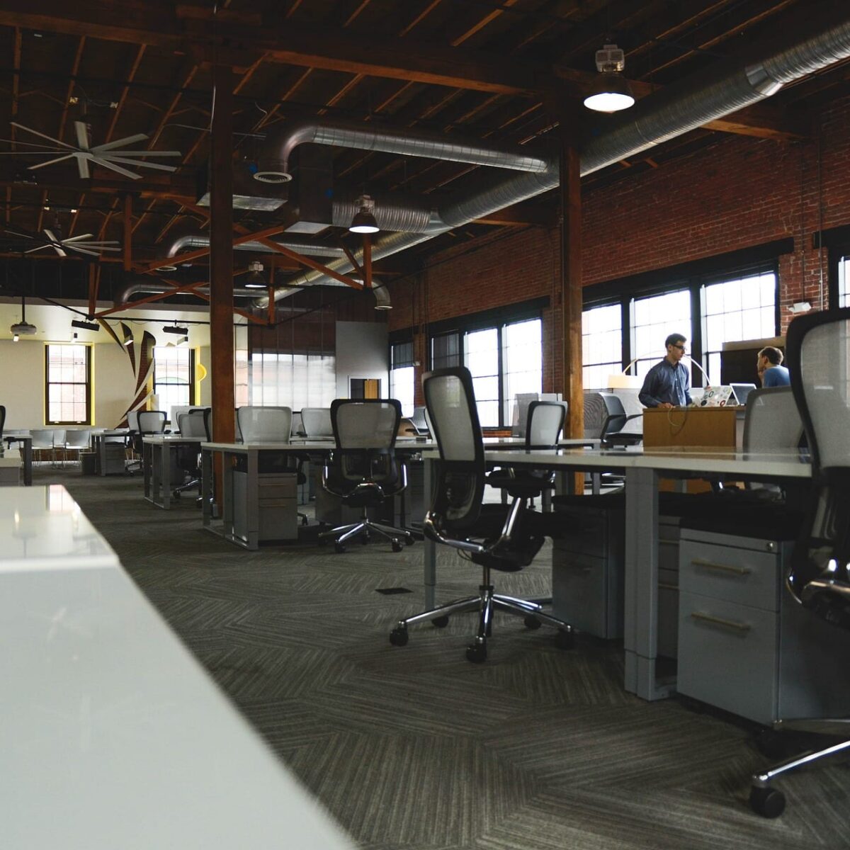 Thrifty Tactics: Boost Your Startup's Buzz on a Budget 2 Open office space, symbolizing the benefits of co-working office spaces for startups
