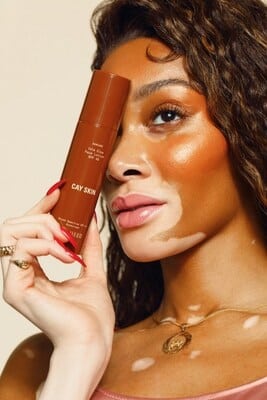 Experience Winnie Harlow's innovative suncare line debut on QVC, catering to all skin tones.